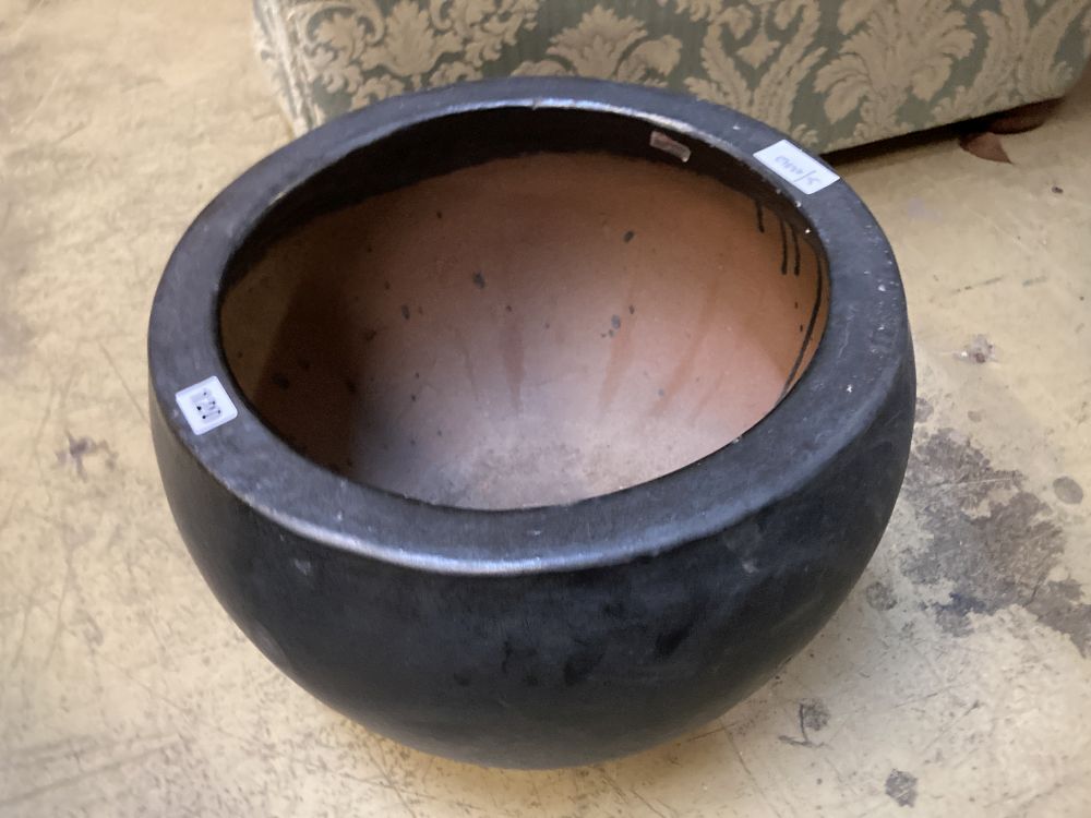 A circular grey glazed garden planter, diameter 43cm height 33cm
